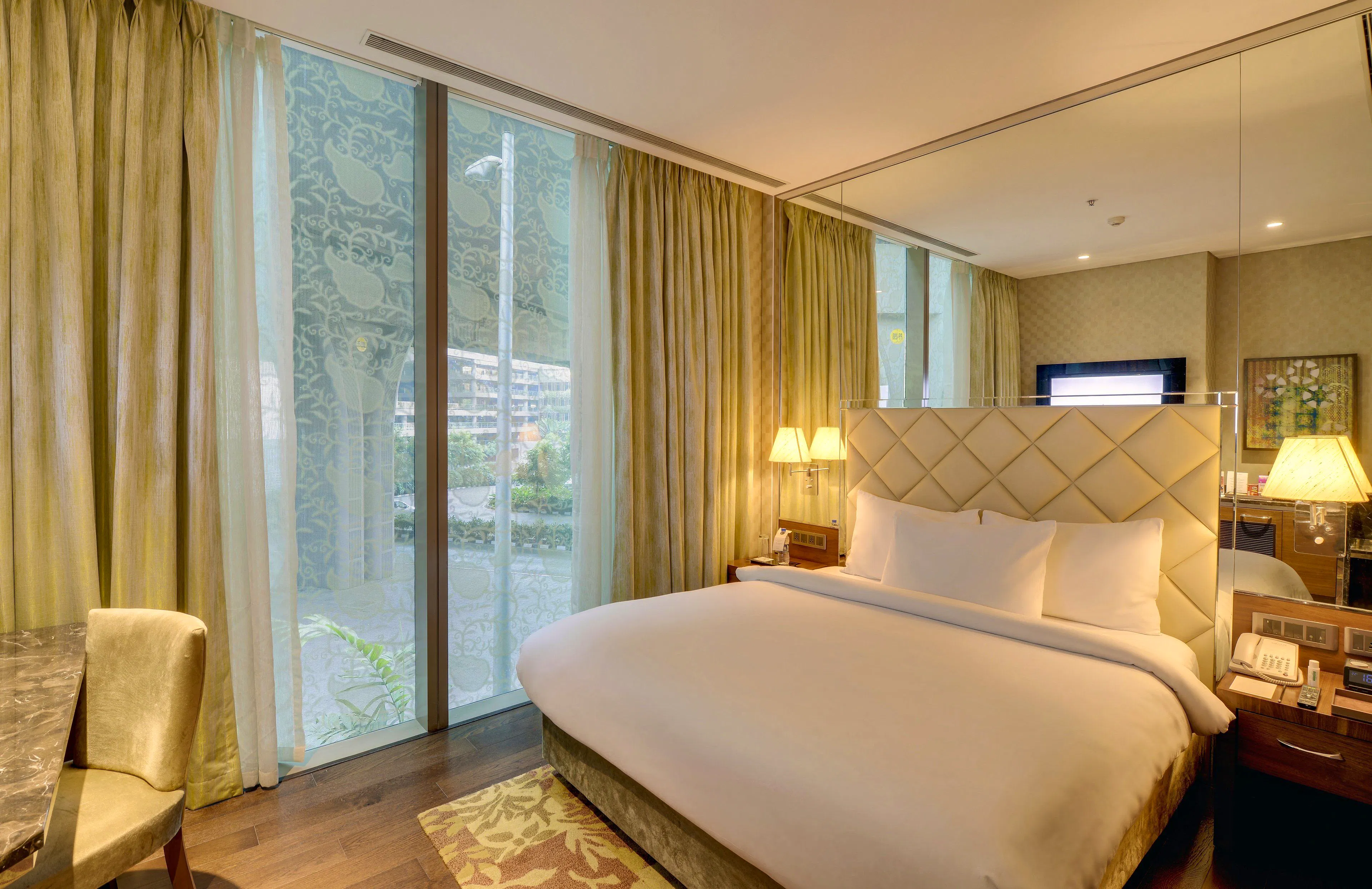 Guest room with premium bedding at Niranta Transit Hotel