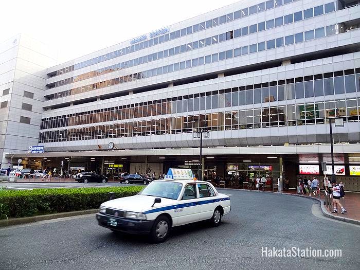A taxi leaves the Chikushi or east side of Hakata Station
