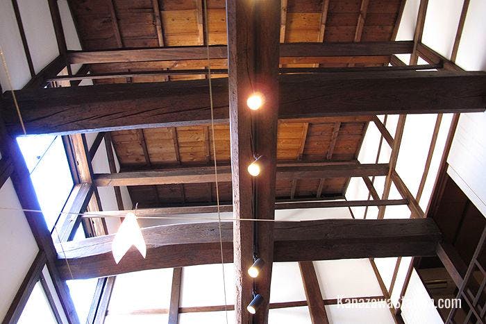 Inside Muku broad wooden beams support the high ceiling