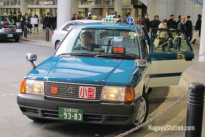 A taxi at Nagoya Station with its automatic door open