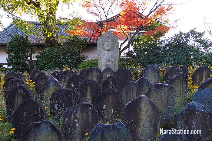In the grounds you will find many Buddhist figures, grave markers, and stone lanterns