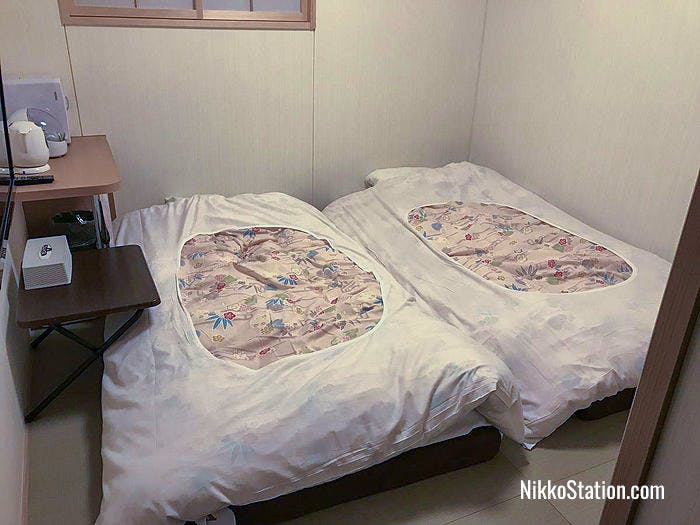 A room with twin beds