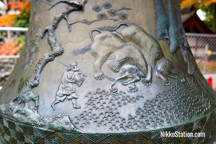 A detail of the elephants on one of the bronze lanterns