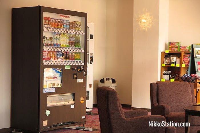 A soft drinks vending machine in the hotel lounge area