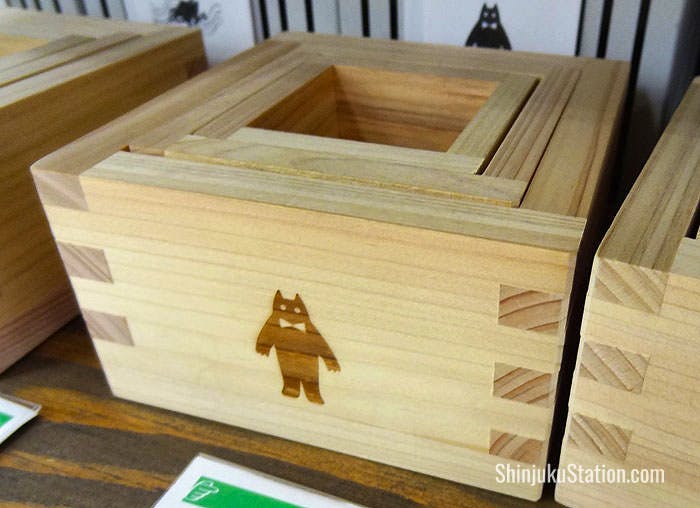 Nearby are traditional masu nested cypress boxes, which can be used for drinking sake or as storage containers