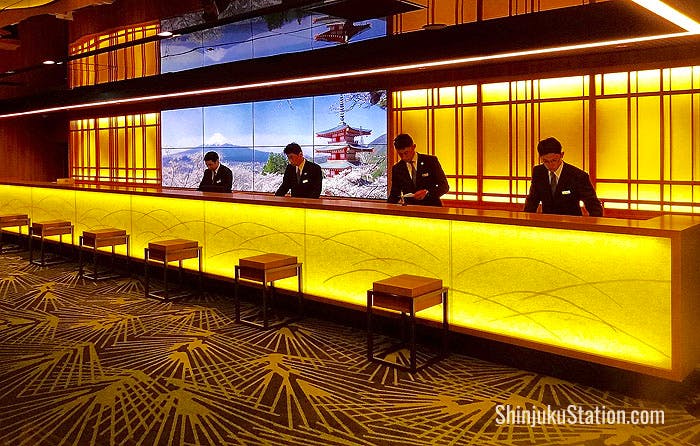 The renovated lobby features a sleek front desk with LCD screens showing eye-popping views of Japan 